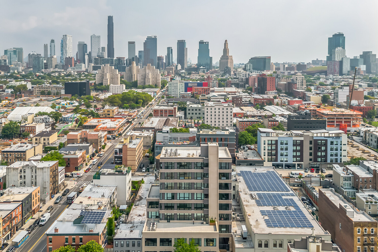 Aerial view of 497 Carroll Street in Gowanus, Brooklyn, with the Manhattan skyline in the distance